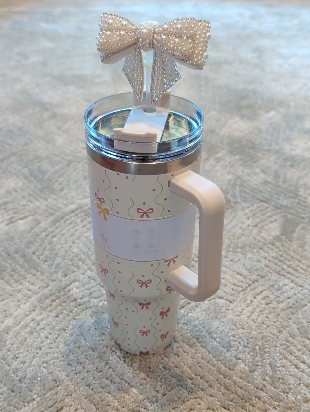 White Patterned Travel Mug with Handle and Decorative Bow